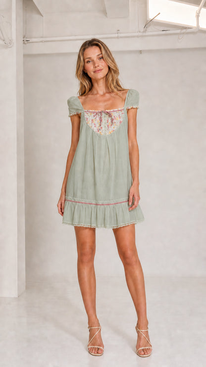 Sage green floral bib babydoll mini dress front view
