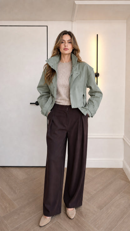 Model wearing sage green cropped faux leather jacket