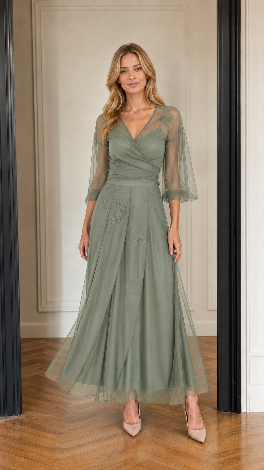 Model wearing sage green embroidered tulle evening dress