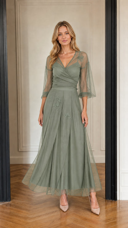 Model wearing sage green embroidered tulle evening dress