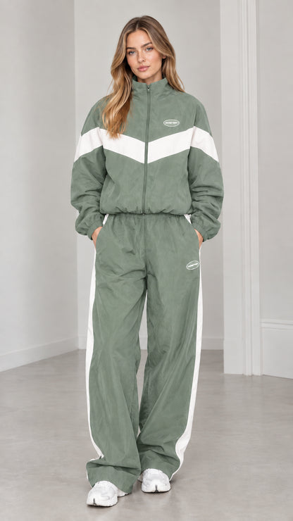 Full length view of woman wearing sage green and white colorblock tracksuit set