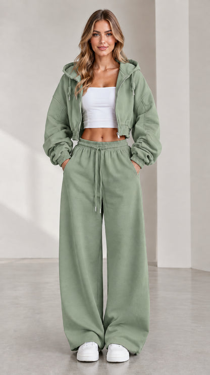 Woman wearing sage green cropped zip-up hoodie and wide-leg fleece sweatpants set