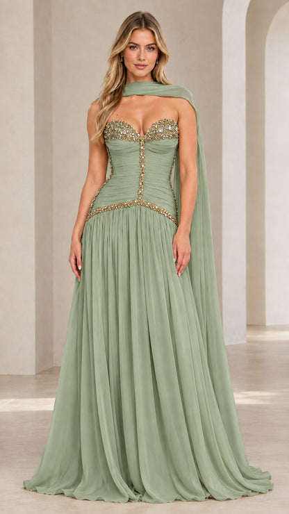 Model wearing sage green strapless embellished corset chiffon evening gown with matching neck scarf