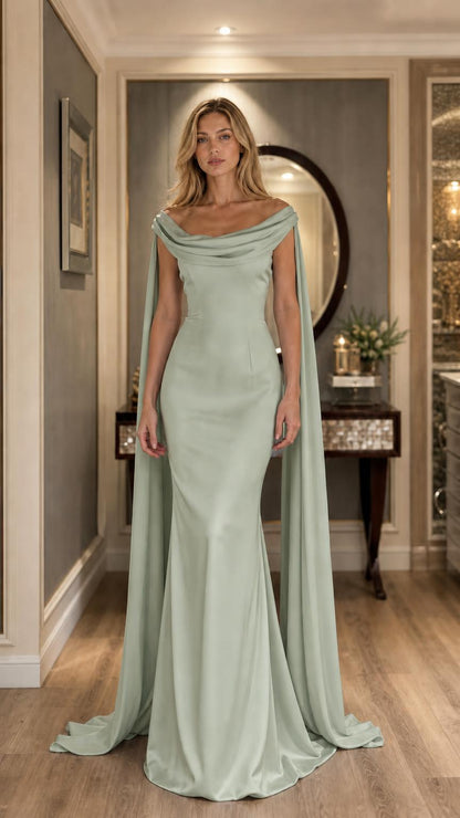 Sage green evening dress with flowing cape on model
