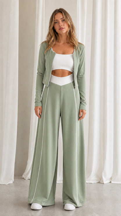 Front view of women's sage green 2-piece lounge set with white piping accents