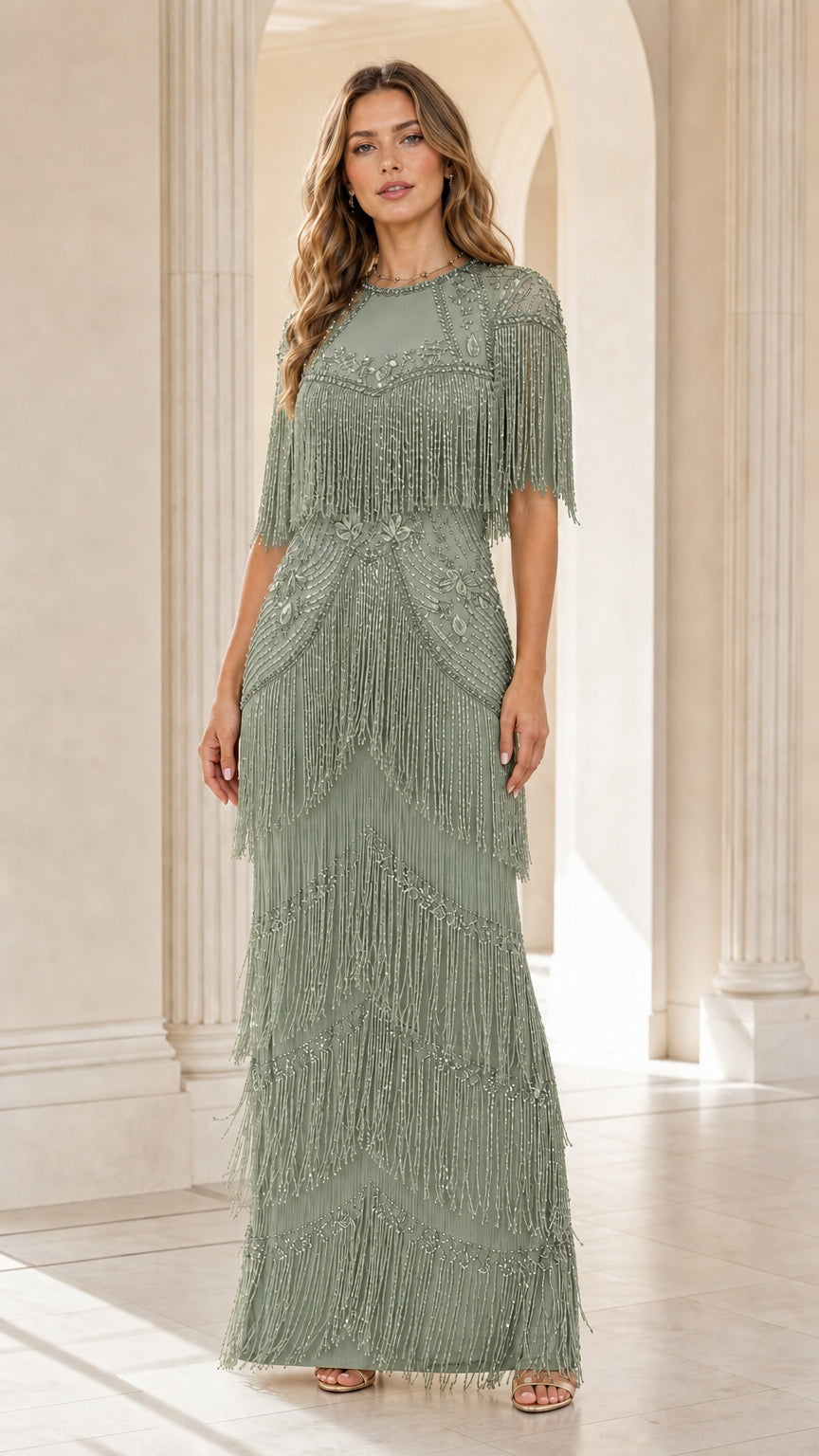 Front view of woman wearing sage green beaded tassel maxi evening gown