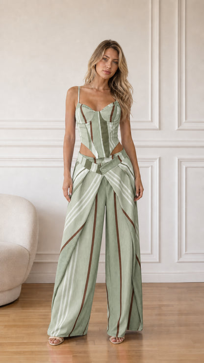 Model wearing sage multi striped corset top and wide-leg pants