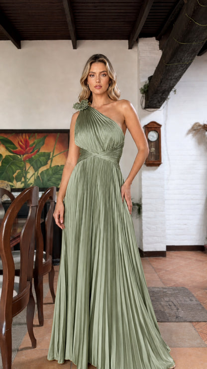 Front view of green one-shoulder pleated maxi dress