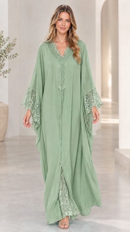 Model wearing sage green wide-sleeve lace-trim kaftan maxi dress
