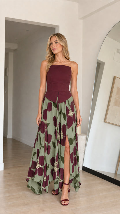 Model wearing sage green variant of strapless floral maxi dress