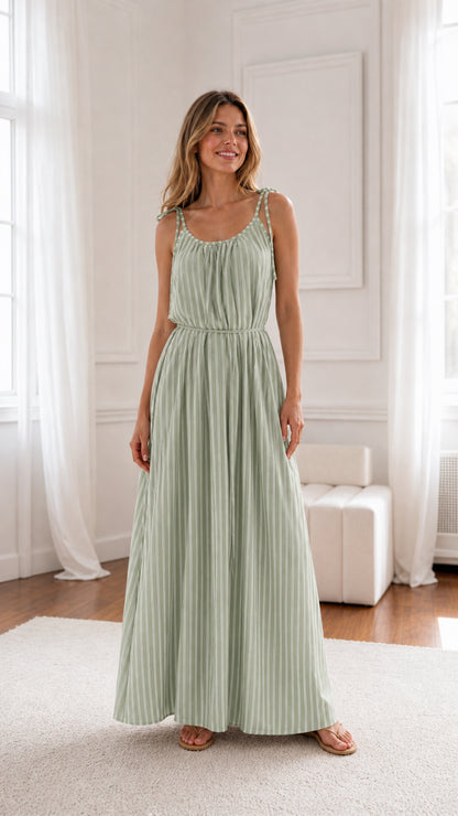 Woman wearing sage green striped maxi dress