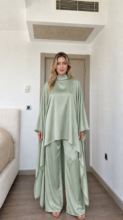 Front view of woman wearing Sage Green satin high neck cape tunic and wide-leg pants set