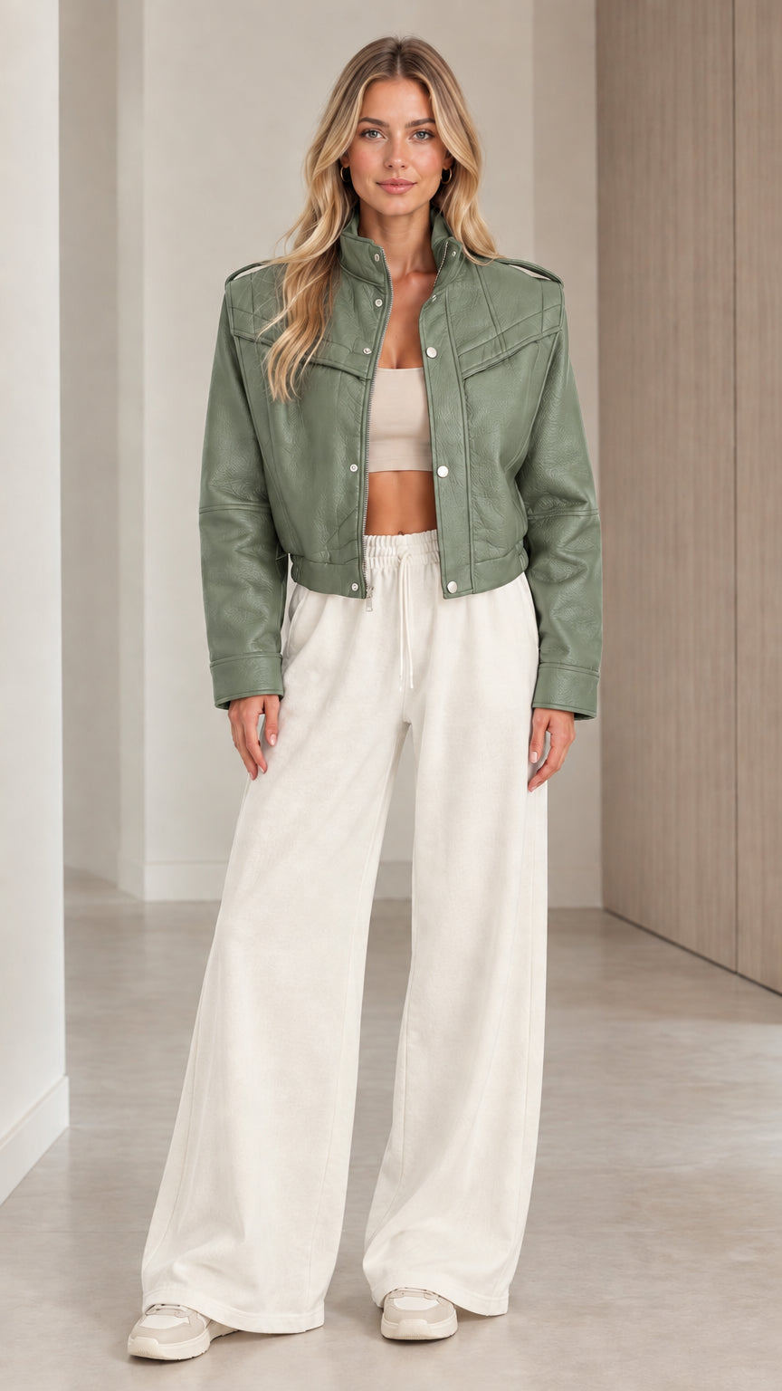 Front full view of woman wearing the cropped faux leather jacket in Sage Green