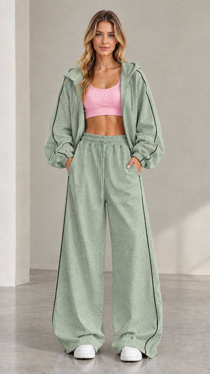 Model wearing Sage Green two-piece tracksuit set with contrast stripe