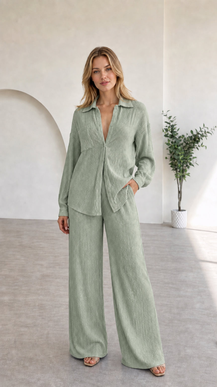 Full view of model in sage green textured two-piece lounge set