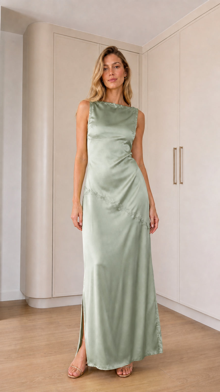Front full-length view of model wearing sage green sleeveless satin maxi dress