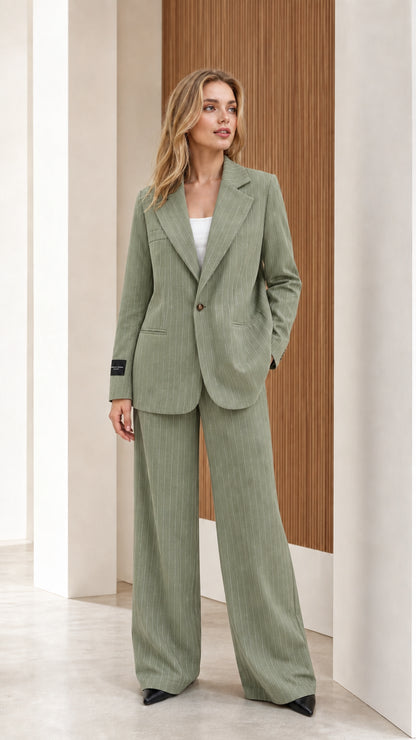 Model wearing sage green pinstripe tailored two-piece pantsuit