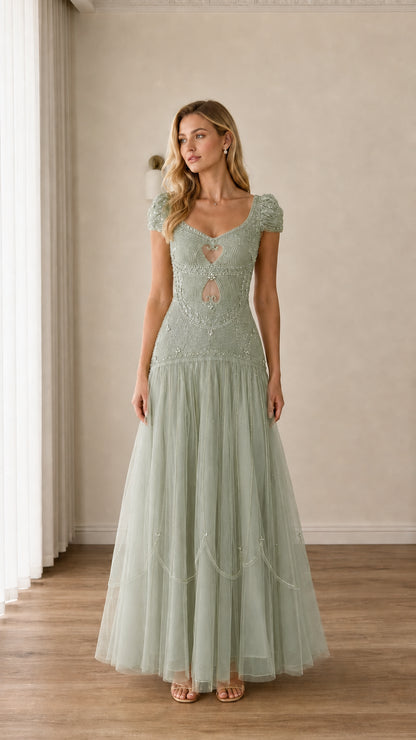 Full-length view of sage green beaded cap-sleeve cutout tulle evening gown