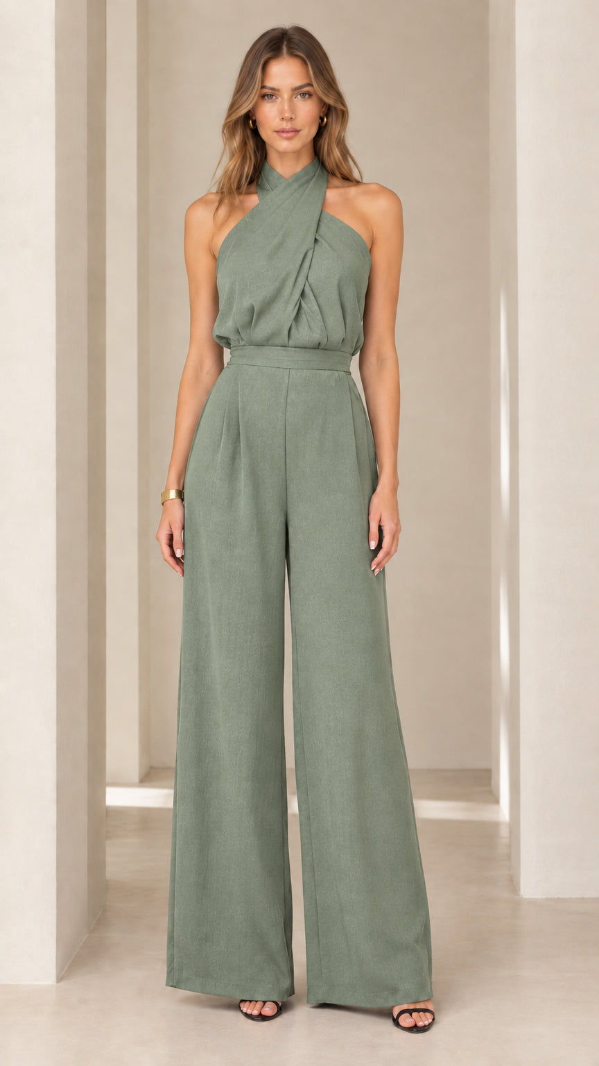 Model wearing sage green crisscross halter neck wide-leg jumpsuit