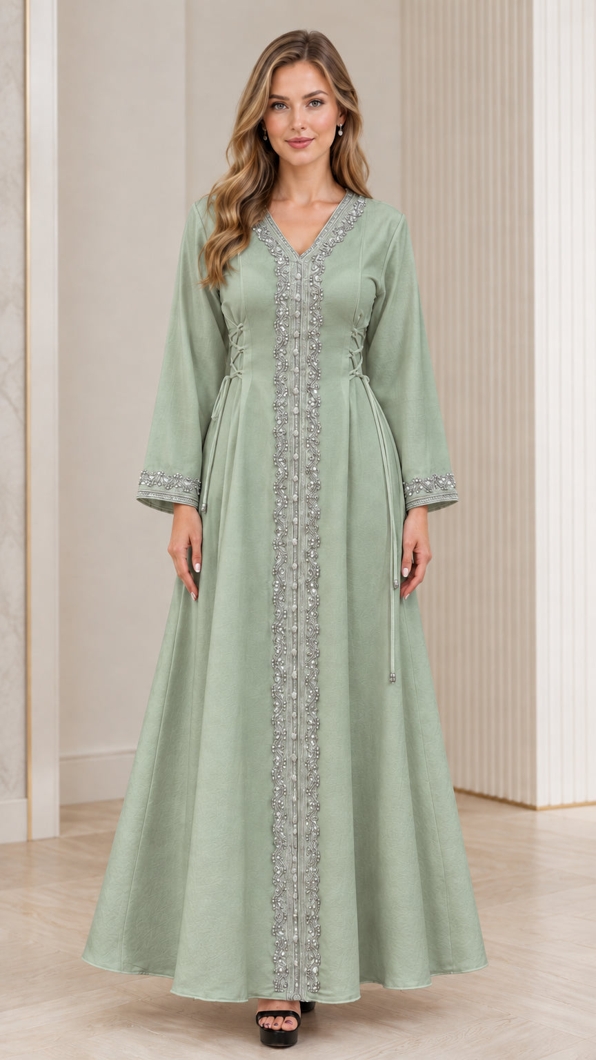 Full-length view of woman wearing sage green embroidered modest kaftan gown