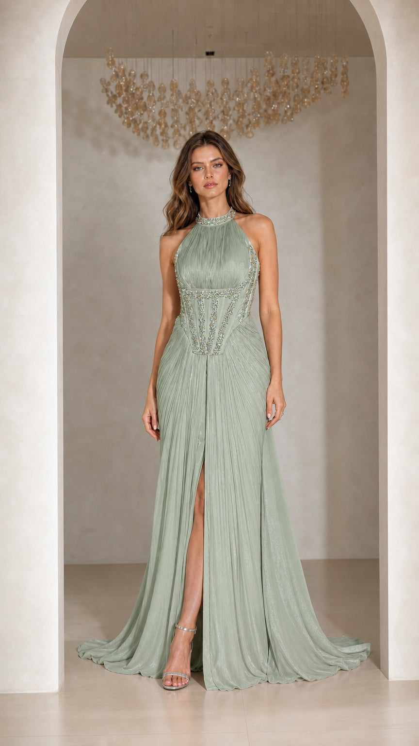 Front view of woman wearing Sage Green pleated halter corset evening gown