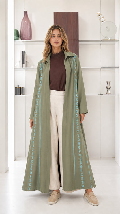 Model wearing Sage Green embroidered longline open front abaya coat