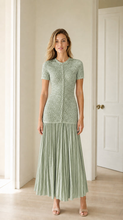 Front view of sage green pearl button knit bodice pleated midi dress