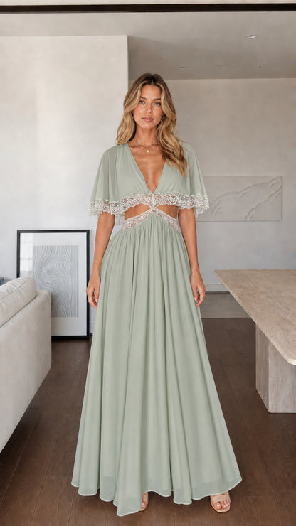 Front view of woman wearing sage green maxi dress with lace cut-outs
