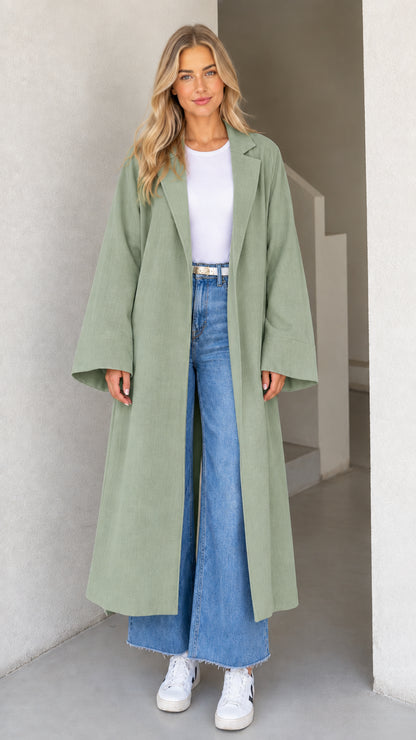 Model wearing Sage Green full-length duster coat with notched lapel