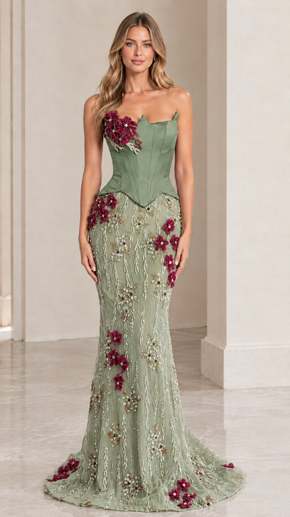 Woman wearing sage green strapless corset mermaid evening gown with floral beadwork