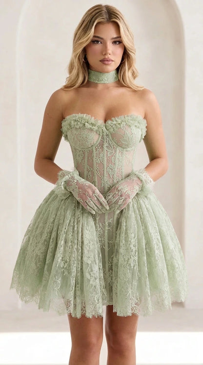 Front view of model wearing sage green lace corset mini dress