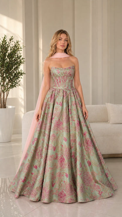 Model wearing sage green floral brocade ball gown