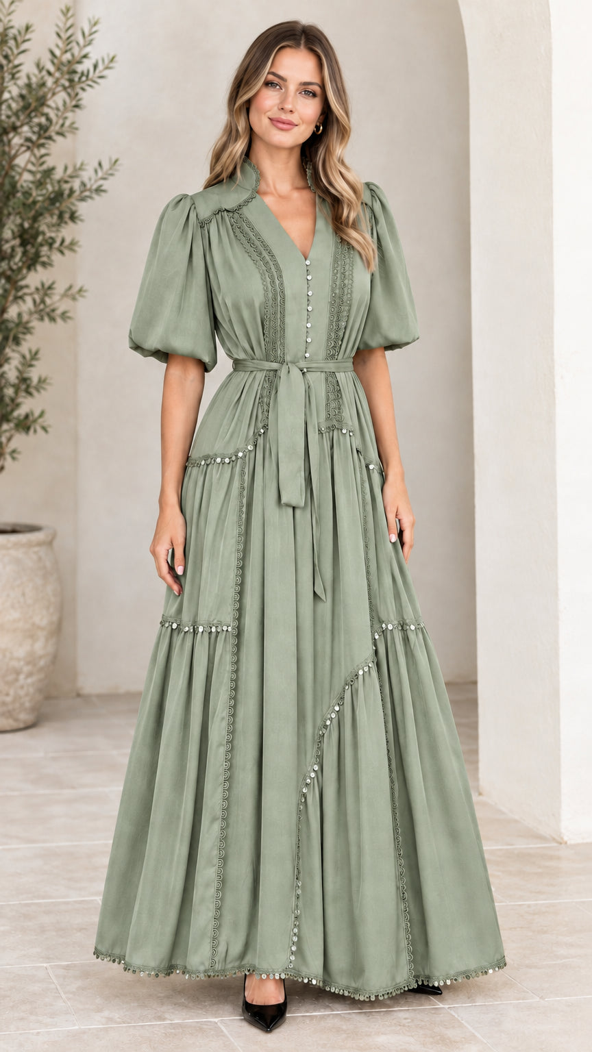 Front view of woman wearing sage green puff sleeve tiered maxi dress