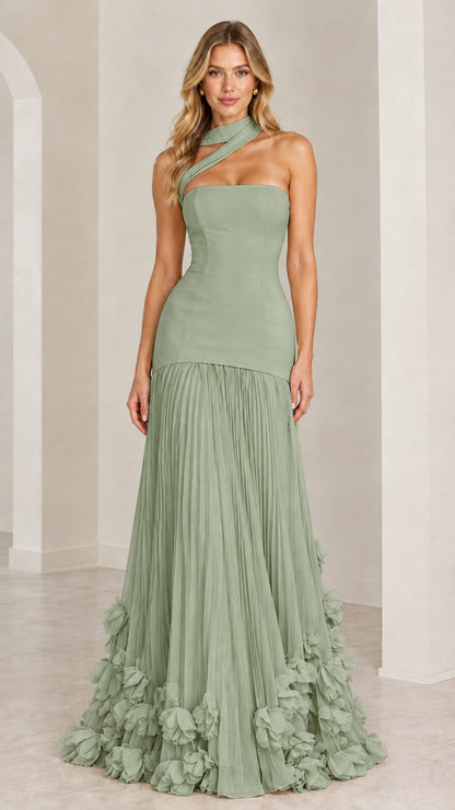 Model wearing the sage green asymmetric pleated drop-waist evening gown