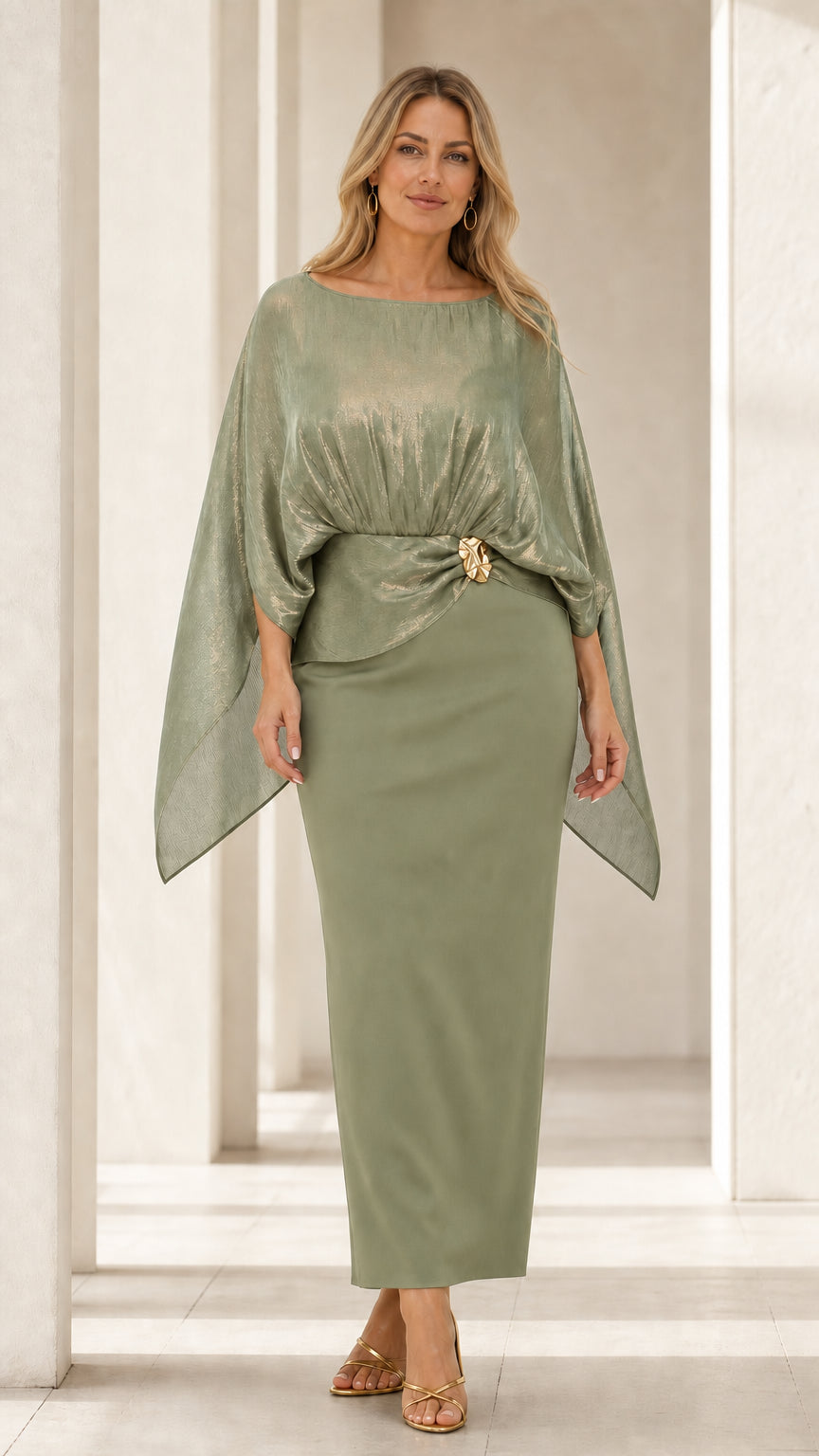 Front view of woman wearing sage green metallic cape overlay maxi dress