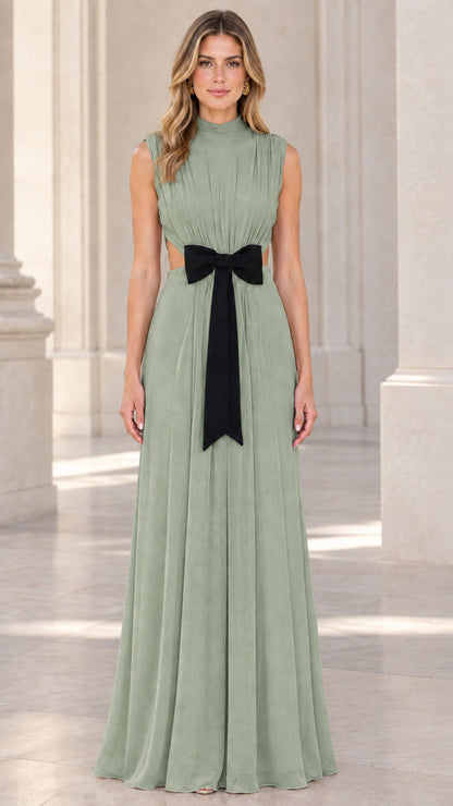 Front view of model wearing sage green pleated high neck maxi gown with bow