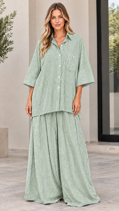 Woman wearing sage green and white striped matching two-piece shirt and trouser set