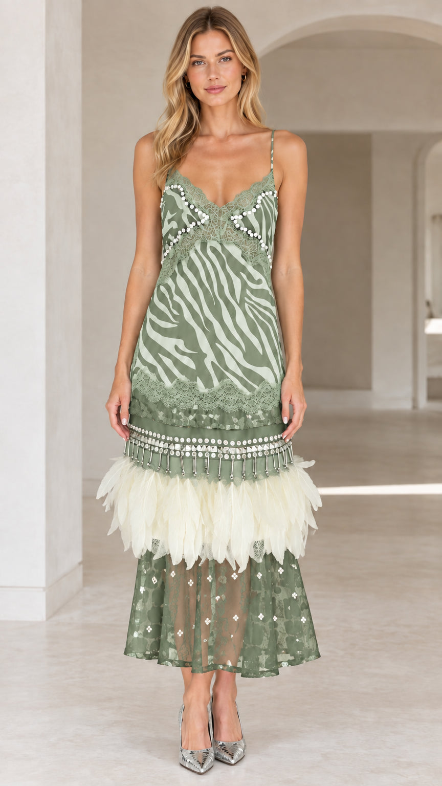Sage green zebra print cami midi dress with feather trim on model