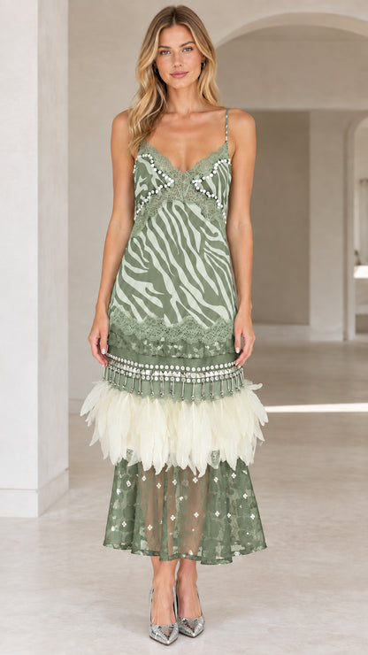 Sage green zebra print cami midi dress with feather trim on model