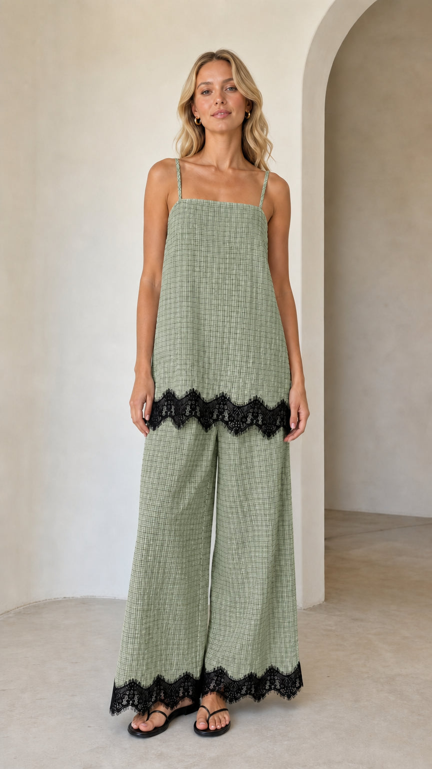 Model wearing sage green plaid two-piece set with black lace hem