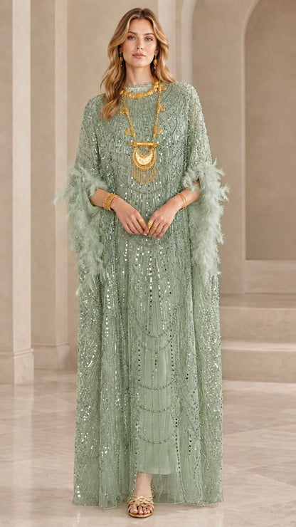 Model wearing sage green sequin kaftan maxi dress with green feather trim