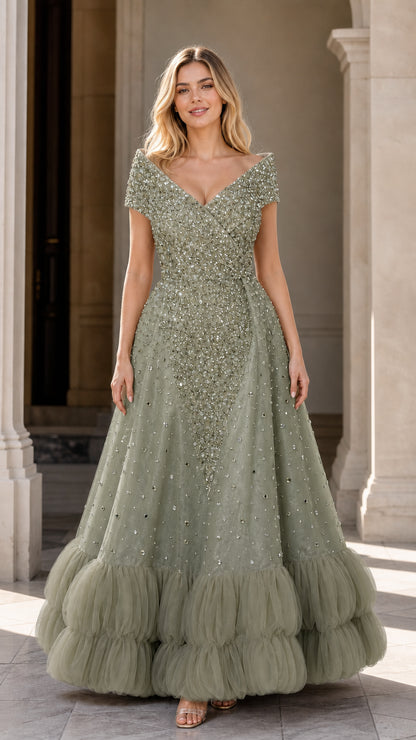 Front view of sage green embellished formal evening gown with tiered hem