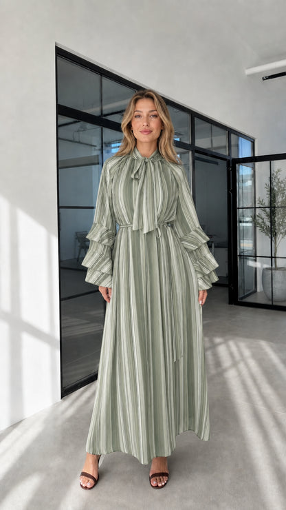 Model wearing sage striped ruffle sleeve maxi dress front view