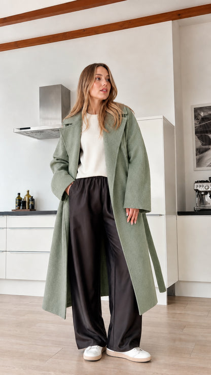 Model wearing sage green full-length wrap coat