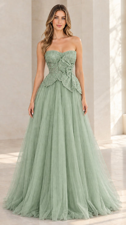 Model wearing sage green strapless beaded tulle formal gown