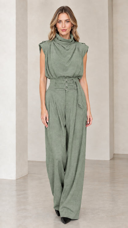 Model wearing sage green sleeveless drape high neck wide leg jumpsuit
