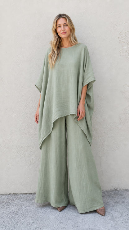 Woman wearing sage green two-piece poncho and wide leg pants set
