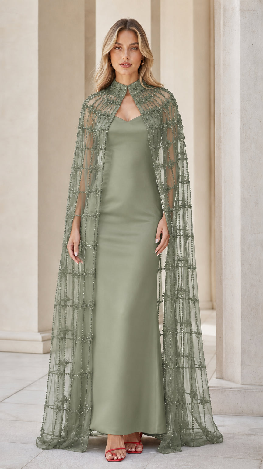 Model wearing sage green beaded cape and matching evening gown