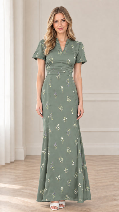 Front view of model wearing sage green floral print maxi dress