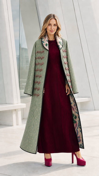 Model wearing the sage green variant of the quilted long coat
